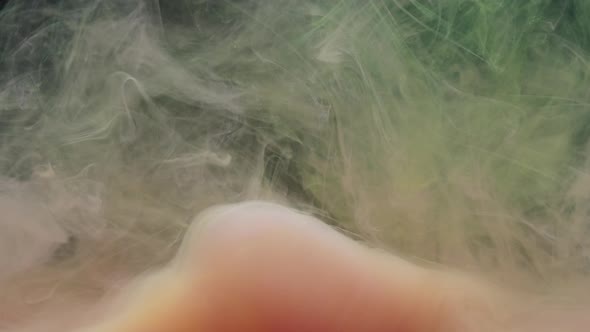 Pink and Yellow Ink Acrylic Paint Mixing in Water Swirling Softly Underwater alt