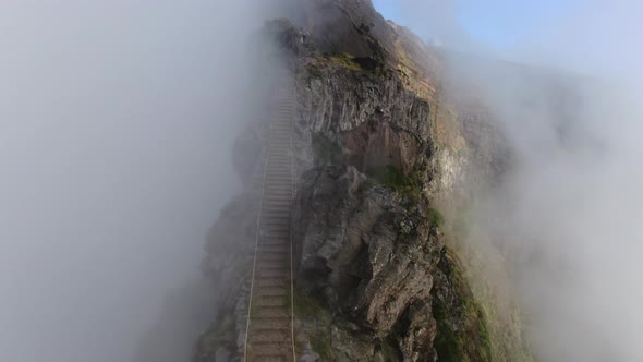 Staircase On Mist Covered Mountain Top alt