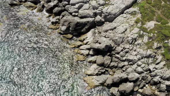 Clean Sea Waves And Rocks Aerial View