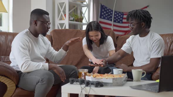 Wide Shot of Asian Woman and African American Men Stacking Hands in Slow Motion Laughing alt
