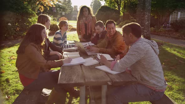 Group of college students on campus meeting outdoors