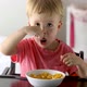 Little Boy Eating Cornflakes for Breakfast