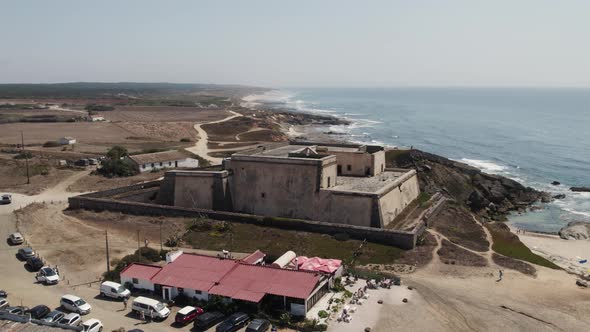 Fortress on Porto Covo coast, Portugal. Aerial orbiting