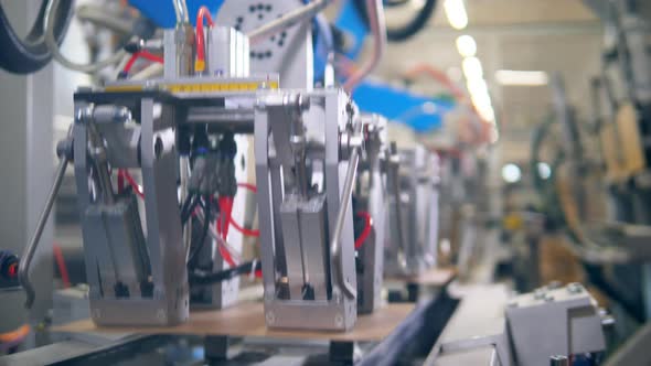 Plates of Carton Are Being Relocated By Factory Equipment. Modern Factory Equipment alt