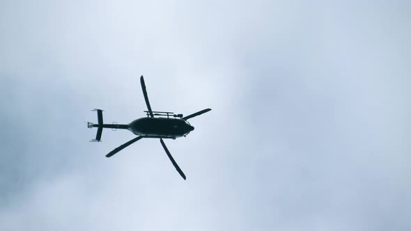 Silhouette of a Modern Helicopter in the Sky