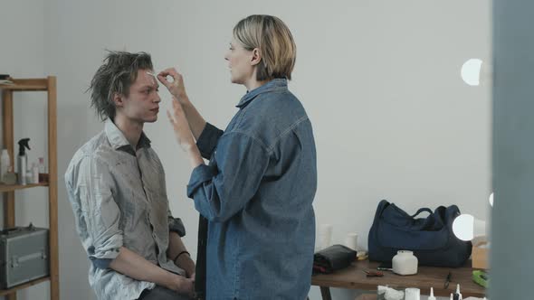 SFX Makeup Artist Working with Zombie Movie Actor alt