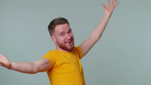 Funny Joyful Man Making Playful Silly Facial Expressions Grimacing Fooling Around Showing Tongue alt