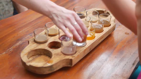Tourists Degustating Various Coffee and Tea Drinks at Kopi Luwak Farm Bali   Handheld Closeup alt