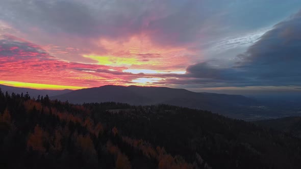 Epic cinematic aerial shoot of stunning beaty colourfull sunset in autumn beskid mountains