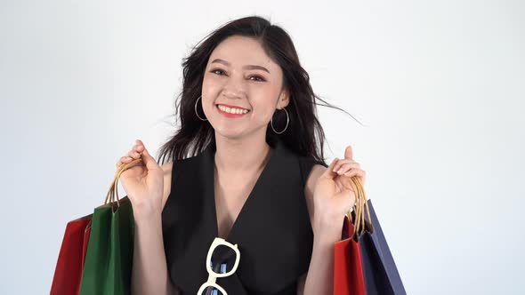 happy woman holding shopping bag