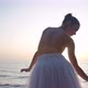 Back View Slim Woman in Tutu Dancing in Sunbeam in Slow Motion on Sea Shore Outdoors - VideoHive Item for Sale