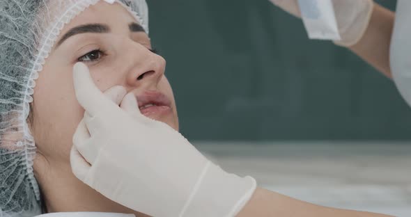 Lip Augmentation, Close Up. The Doctor Cosmetologist Preparing for Lip Augmentation Procedure alt