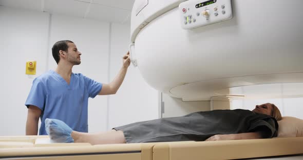 Examination of Patient Using MRI Magnetic Resonance Imaging Machine Hospital