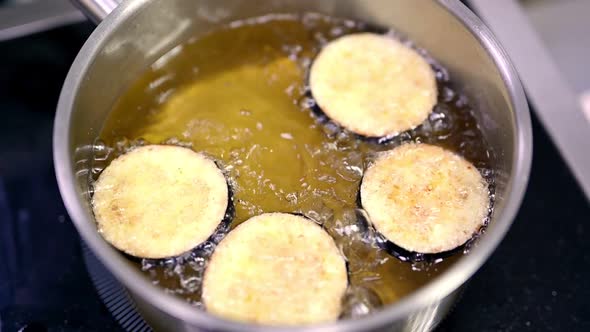 Eggplants Frying in Hot Oil