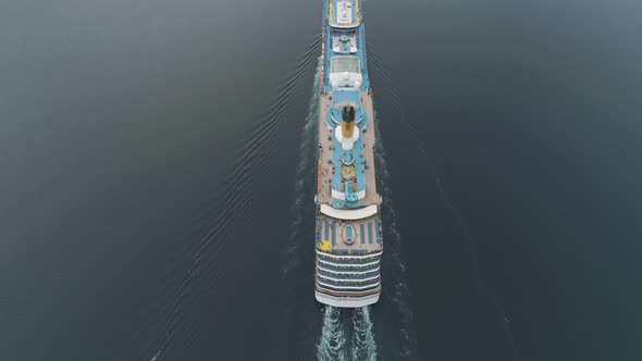 Large Luxury Cruise Ship Is Going in Fjord of Norway. Aerial Vertical View. Reveal Shot alt
