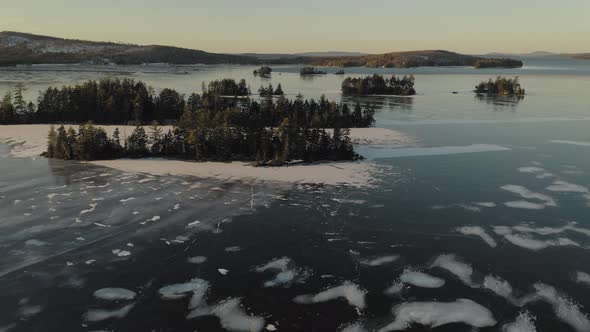 Panorama of frozen Moosehead Lake. Maine. USA. Aeriale forward alt
