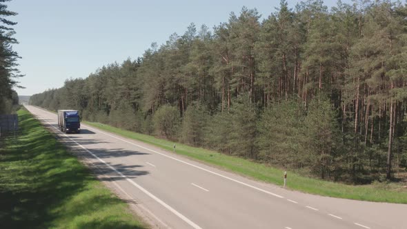 Semi Truck Driving on the Countryside Road
