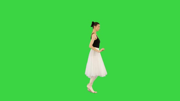 Young Ballerina Runs Slowly Making Arms Movements on a Green Screen Chroma Key alt