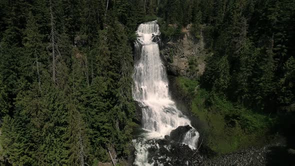 Aerial Dolly Of Multi Tier Waterfall In British Columbia Wilderness alt