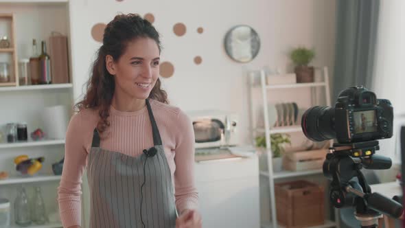 Vlogger Talking on Her Camera alt