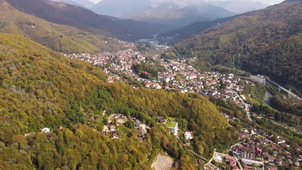 Aerial view from a drone of a settlement at the foot of the mountains.