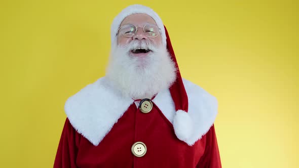 Happy Santa Claus in eyeglasses smiling looking at camera