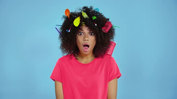 Woman with plastic garbage in the hair.