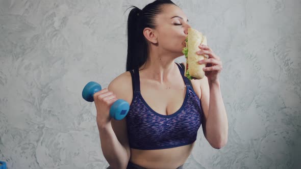 Athletic Woman Eating Junk Food alt
