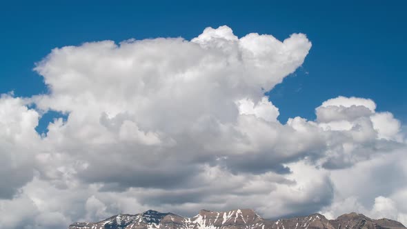 Clouds moving over the top of Timpanogos Mountain alt