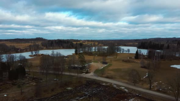 Araisi Lake Castle in Latvia Aerial Shot From Above. Historical Wooden Buildings on Small Island in alt
