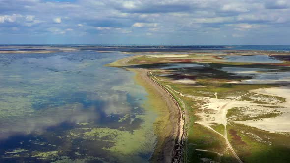 Beautiful flight in summer over salt lakes. Dry lakes. Green grass. alt
