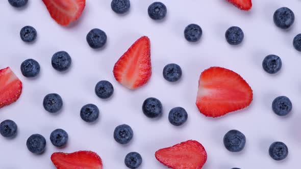 Rotation Background of Blueberries Strawberries on a White Background  the Concept of a Healthy Diet