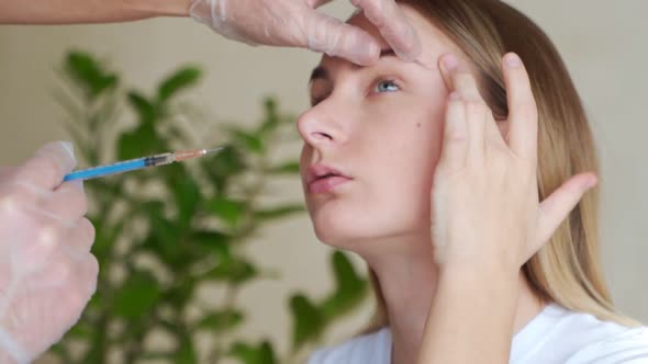 Injection Into the Eyelid the Eyes of the Woman alt