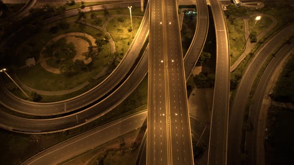 Aerial view shot of fast moving above interchange and multi junction road alt