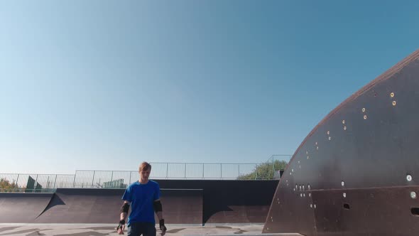 A Man Riding In A Skate Park alt