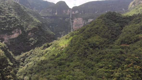 Drone shot of the Gocta falls in the Amazon of Peru from far away flying toward the falls alt