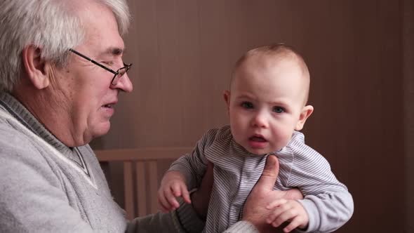 Family Relations of Elderly Man and Baby Girl alt