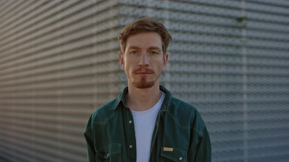 Portrait of Redhead Guy in Casual Wear Posing Outdoors alt