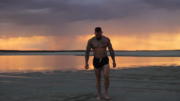 Masculine Man on Shore at Sunset