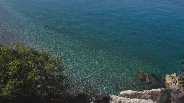 Beautiful Blue Sea Near Island of Sveti Stefan on Sunny Summer Day in Montenegro alt