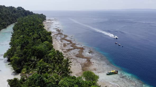 Aerial view of a beautiful beach lagoon in Kakaban island with clear blue water