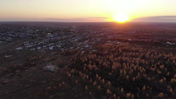 Aerial View Of The Village At Sunset, Autumn Fields And Groves