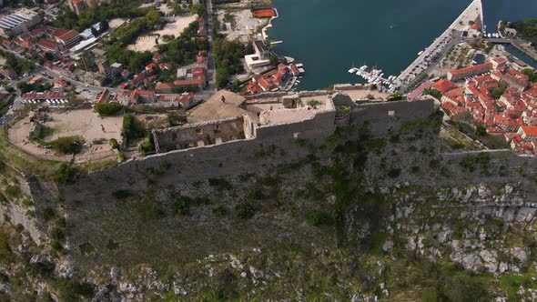 Aerial Shot of the Fortress St John San Giovanni Over the Old Town of Kotor the Famous Tourist Spot alt