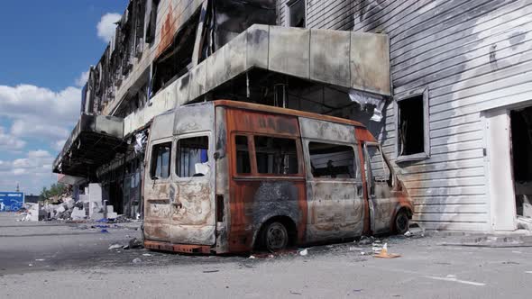 Wartorn Building of a Shopping Center in Bucha Ukraine alt