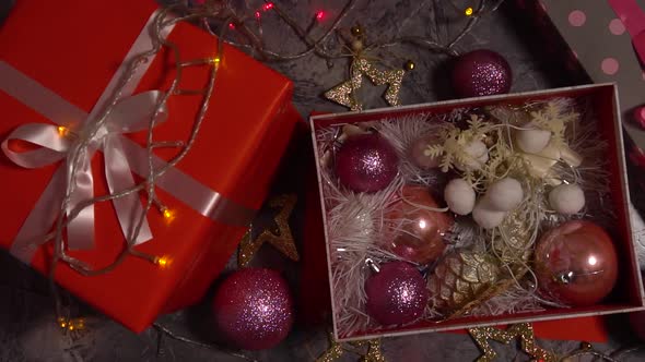 Red Gift Box and Opened Box with Christmas Decorations