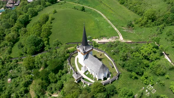 Flying Above Valeni Hungarian Reformed Church, Transylvania, Romania alt