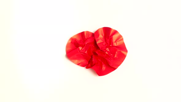 Red Paper Heart Beat on white background Crumple and Uncrumple Stop Motion Animation alt