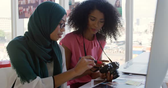 Young women working in a creative office alt
