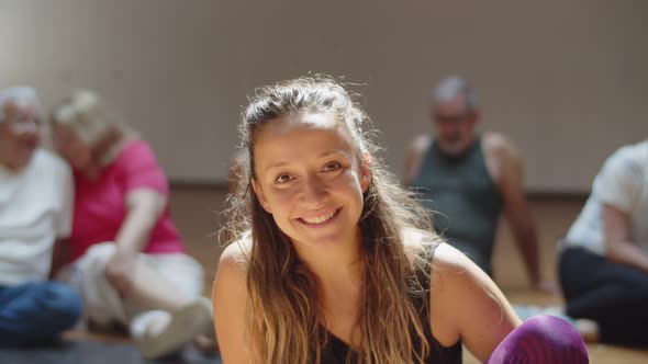 Medium Shot of Cheerful Female Dance Teacher in Ballroom