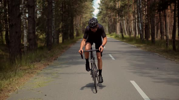 Cyclist Training Leisure Twists Pedals On Triathlon Bicycle. Gear System  And Bike Wheel. Workout. alt